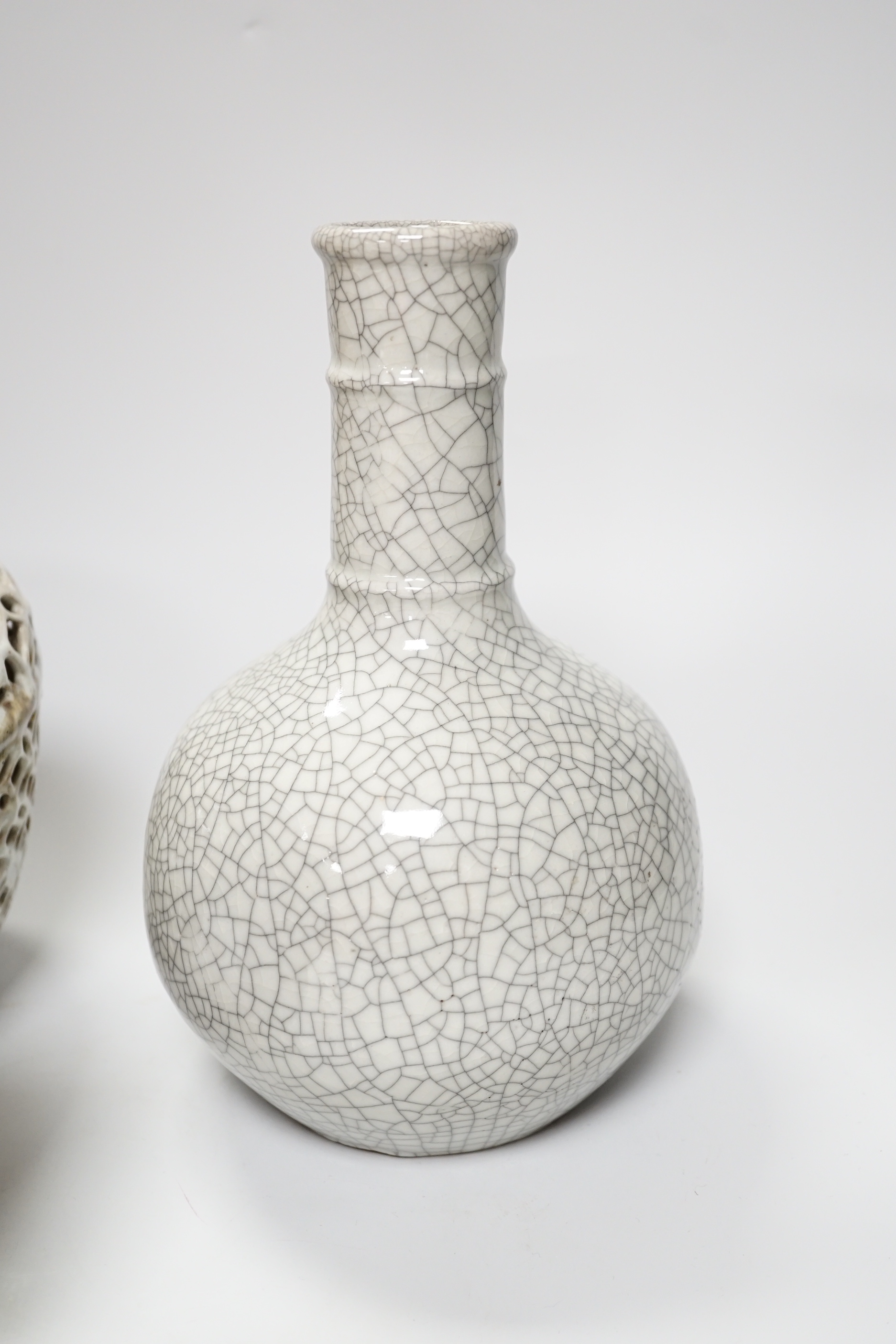A Chinese crackle glaze bottle vase, a reticulated pottery vase and pottery vase, tallest 23cm high